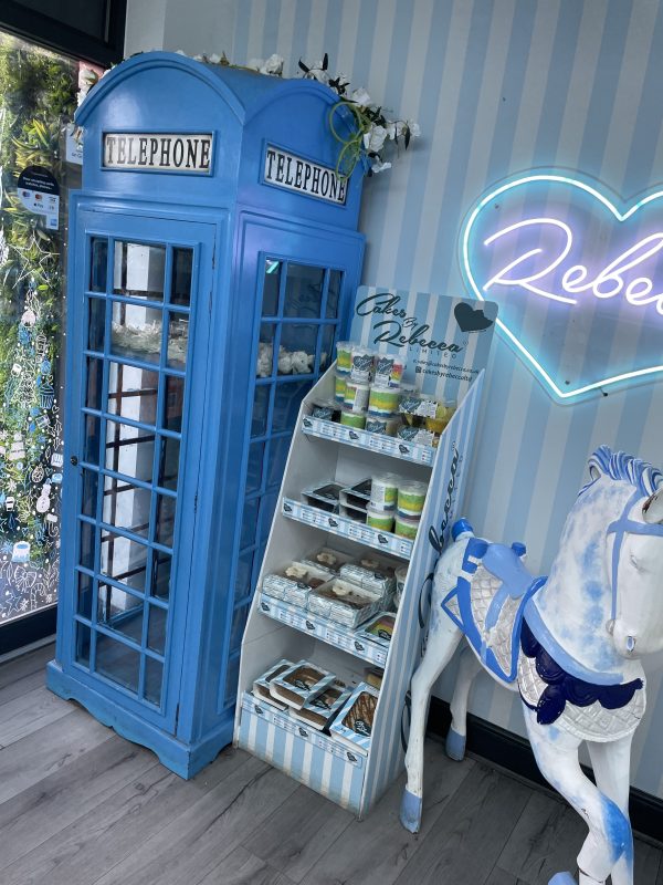 blue telephone box in cakes by rebecca shop